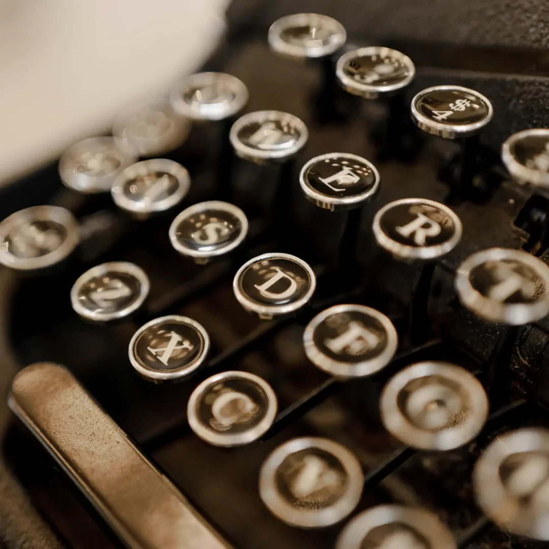 The typewriter in the great hall looks like it's from the 1920s, maybe the 1930s. It's black and made of metal, so it would be pretty heavy.
